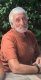 Older gentleman in rust shirt
