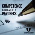 pen and blank check with text competence is not about a paycheck
