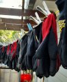 A row of gardening gloves pinned on a line
