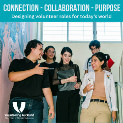 A group of 5 people walking down stairs smiling and talking to each other