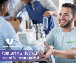 smiling man volunteering in a soup kitchen