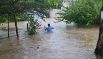 man-in-floodwaters-jan-2023