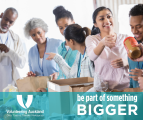 A group of diverse people volunteering at a food bank
